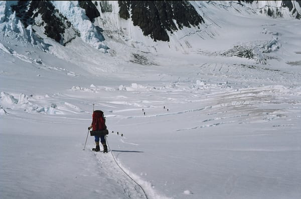 A mountaineer approaching a crevasse field